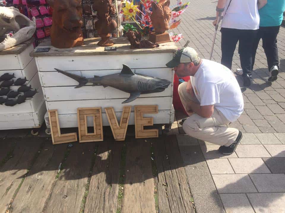 David blowing kisses at a shark in Brighton, England.
