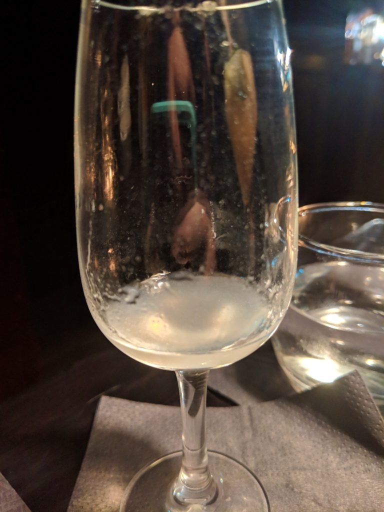 a sip of a salmon flavored cocktail