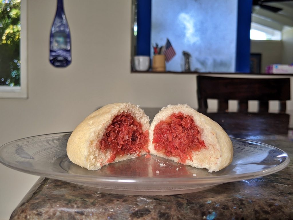 Pork filling inside of a steamed manapua bun